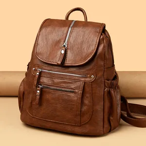 Sac à dos vintage en cuir souple marron avec plusieurs poches zippées pour femmes