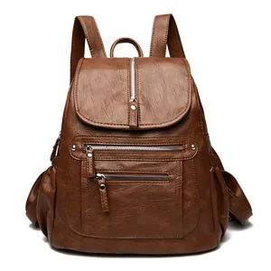Sac à dos vintage en cuir souple marron pour femme avec plusieurs poches zippées et grand espace