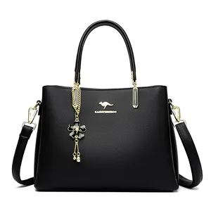 Elegant black textured women's handbag with kangaroo logo and gold flower pendant detail