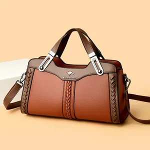 Elegante borsa a mano in pelle marrone con manico superiore e dettagli intrecciati
