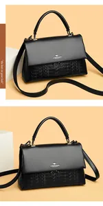 Elegant black leather handbag with embossed texture shown in two professional angles.
