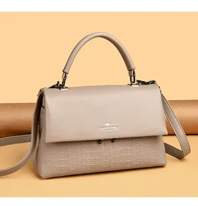 Elegant taupe leather handbag featuring embossed patterns and iconic kangaroo logo detail