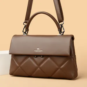 Elegant brown quilted leather handbag with top handle and adjustable shoulder strap