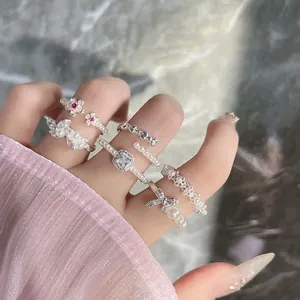 Close-up detail of an elegant French retro style pearl and bowknot fashion ring set