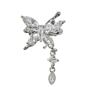 Macro view of the sparkling crystal butterfly ring featuring elegant hanging tassels details.