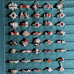 Detailed collection of luxury garnet red crystal rings with floral and crown designs