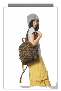 On-model view of the leopard print backpack showing the trendy streetwear style