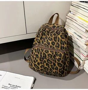 Detailed view of casual leopard print backpack set in a cozy study environment