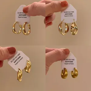 Elegant gold-plated S925 silver hoop earrings with a chic brushed finish.