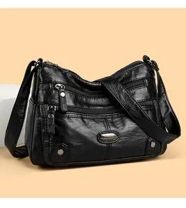 Detailed view of a black multi-pocket shoulder bag featuring high-quality pebbled leather texture