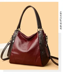 Detailed view of elegant burgundy soft faux leather large tote bag with silver zippers