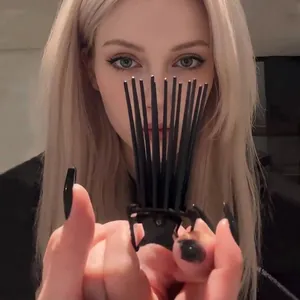 Close-up of hair root lifting clip for voluminous crown effect on blonde hair