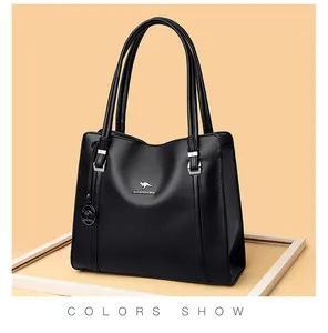 Close-up of black textured leather handbag with kangaroo logo and silver hardware