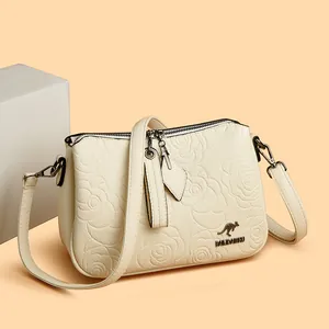 Elegant beige women's crossbody bag with rose embossed texture and chic floral pattern
