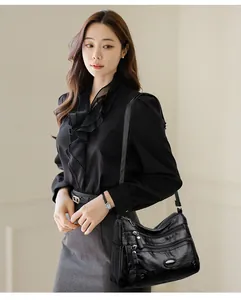 Elegant black multi-pocket shoulder bag with large capacity shown in professional lifestyle setting