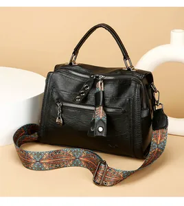 Premium black PU leather Boston bag with a colorful ethnic style wide crossbody strap.