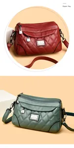 Dettaglio borsa a tracolla in morbida pelle con motivo trapuntato e multi-zip.