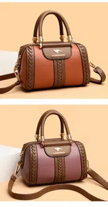 Elegant 2025 women's contrast color handbag with kangaroo logo and woven leather details.