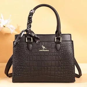 Elegant black crocodile-pattern tote bag with decorative handle scarf