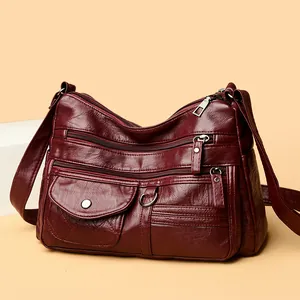 Burgundy multi-zippered crossbody shoulder bag for women with embroidery details