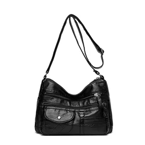 Elegant black quilted crossbody bag for women with multi-zipper design and soft leather