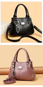 Elegant pebbled leather handbags for women, available in classic black and dusty pink