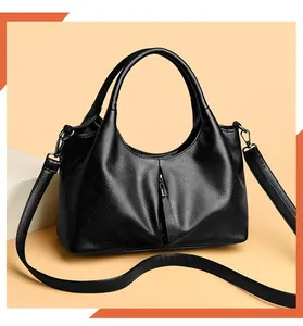 Macro view of the soft black leather texture on this versatile hobo style women handbag.