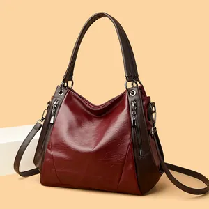 Elegant burgundy and brown soft leather tote bag for women, versatile shoulder handbag.