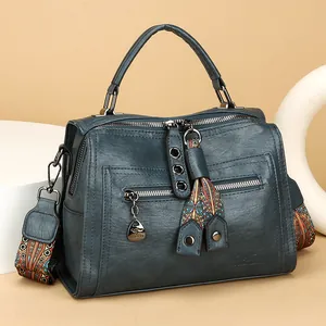 Premium dark teal blue faux leather Boston handbag with multi-zippers and patterned strap