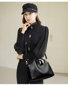 Elegant black lychee pattern leather handbag for women with adjustable shoulder strap