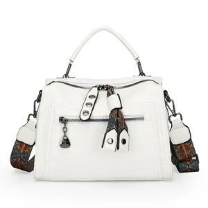 Premium white women's Boston handbag featuring a fashionable colorful patterned strap