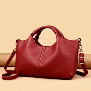 Elegant red pebbled leather handbag and stylish crossbody shoulder bag for women