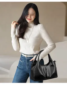 Asian model wearing minimalist black soft leather hobo bag for women