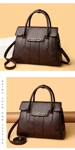 Detailed close-up of a brown leather handbag featuring elegant kangaroo logo hardware.