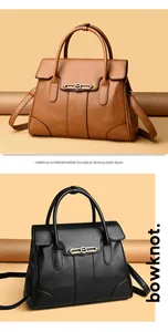 Elegant structured leather handbags in brown and black with gold hardware detail