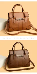 Detailed view of elegant textured leather handbags with kangaroo emblem gold hardware