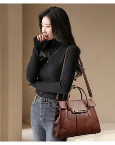Brown leather tote bag shown on model, stylish large capacity shoulder bag lifestyle shot