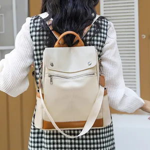 Stylish cream women's anti-theft backpack with brown accents for travel and daily use