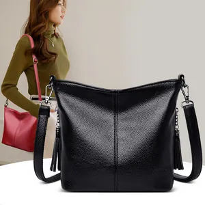 2024 Women's black soft leather crossbody bag with tassels and adjustable strap