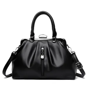 Elegante schwarze Handtasche mit großem Fassungsvermögen und Metallbügelverschluss