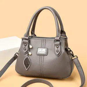 Elegant gray pebbled leather handbag for women, versatile crossbody and shoulder bag.