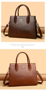 Elegante bolso tote de cuero marrón con asas y correa de hombro ajustable