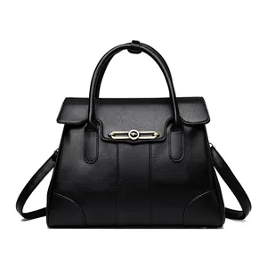 Elegant black leather handbag for women featuring a gold kangaroo buckle and large capacity