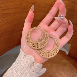 Bohemian hand-woven straw hoop earrings for women, perfect for summer beach vacations