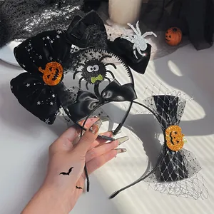 Detailed view of Halloween headbands featuring black bows, spiders, and sparkling pumpkin sequins