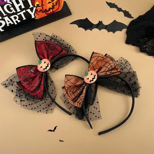 Halloween headbands detail showing spider web mesh bows and glittery pumpkin charms