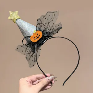Detailed view of Halloween witch hat headband with pumpkin and glitter star accents