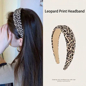 Detailed view of stylish leopard print headband designed for a high cranial top effect