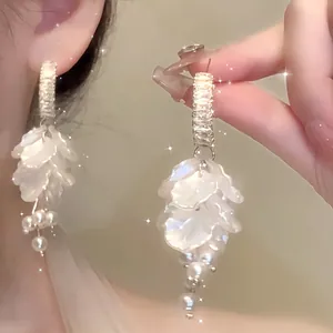 Detailed shot showing elegant French petal pearl earrings with S925 silver needle