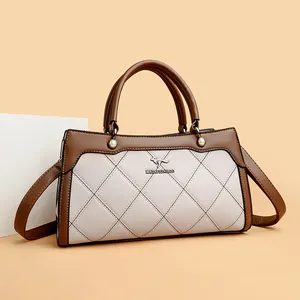Elegant quilted leather handbag with top handles and adjustable crossbody strap for women